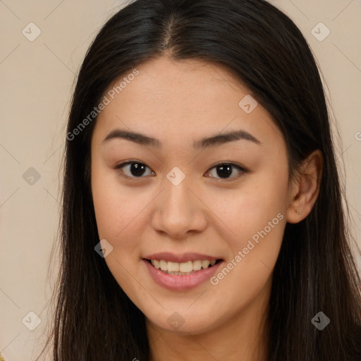 Joyful asian young-adult female with long  brown hair and brown eyes