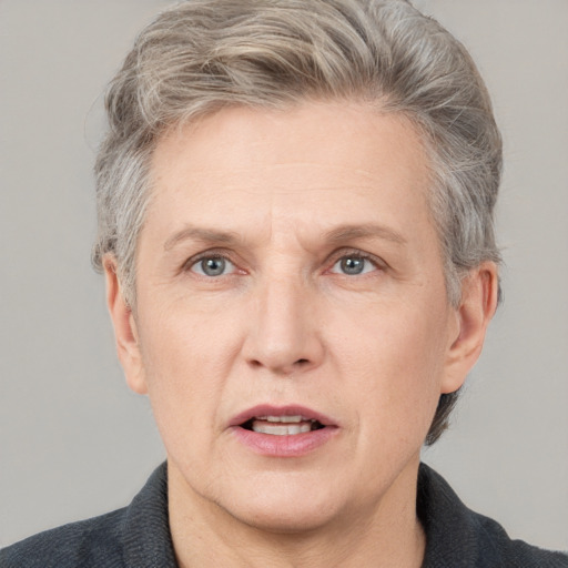 Joyful white middle-aged male with short  brown hair and grey eyes