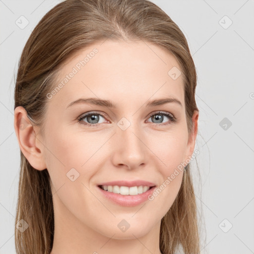 Joyful white young-adult female with long  brown hair and blue eyes