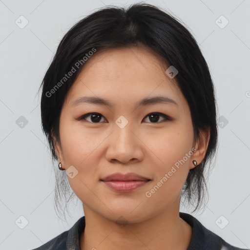 Joyful asian young-adult female with medium  black hair and brown eyes