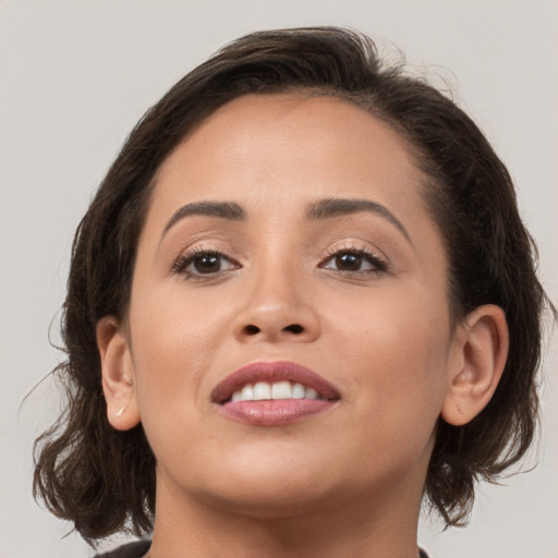 Joyful white young-adult female with medium  brown hair and brown eyes