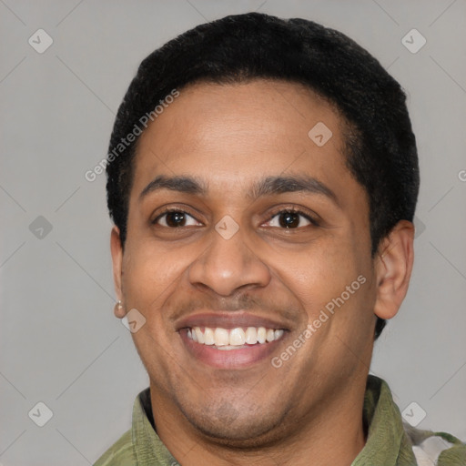 Joyful latino young-adult male with short  black hair and brown eyes