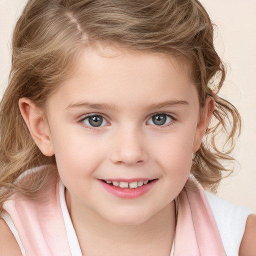 Joyful white child female with medium  brown hair and grey eyes