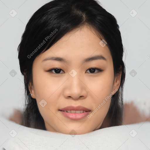 Joyful asian young-adult female with medium  black hair and brown eyes