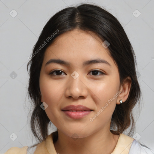 Joyful latino young-adult female with medium  brown hair and brown eyes