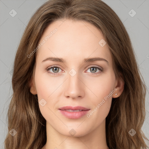 Joyful white young-adult female with long  brown hair and green eyes