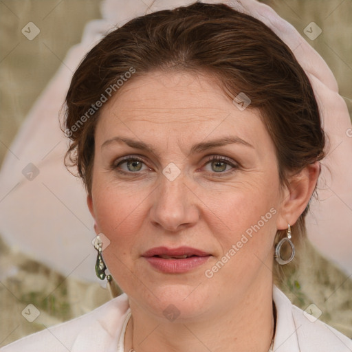 Joyful white adult female with medium  brown hair and blue eyes