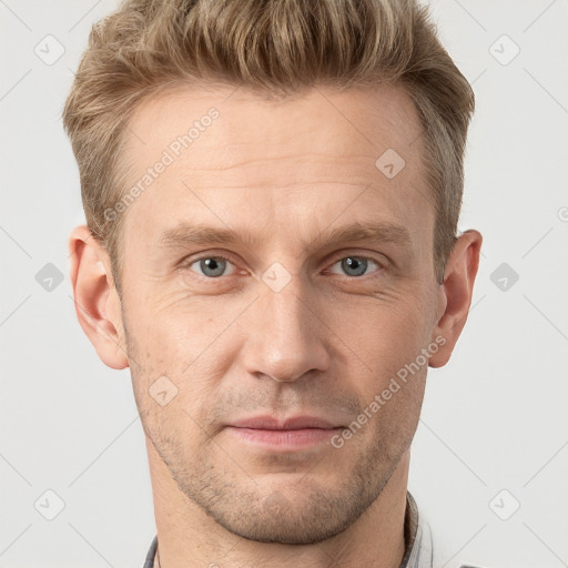 Joyful white adult male with short  brown hair and grey eyes