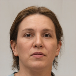 Neutral white adult female with medium  brown hair and brown eyes