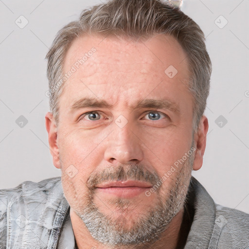 Neutral white adult male with short  brown hair and grey eyes