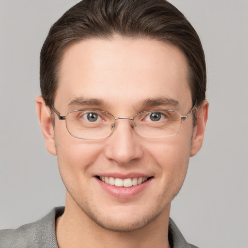 Joyful white adult male with short  brown hair and grey eyes