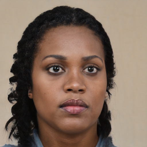 Neutral black young-adult female with long  black hair and brown eyes