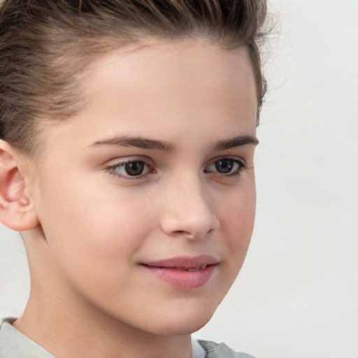 Joyful white child female with short  brown hair and brown eyes