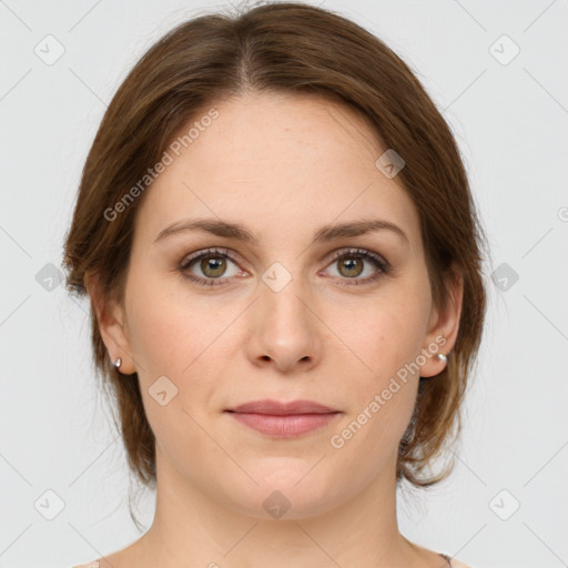 Joyful white young-adult female with medium  brown hair and green eyes