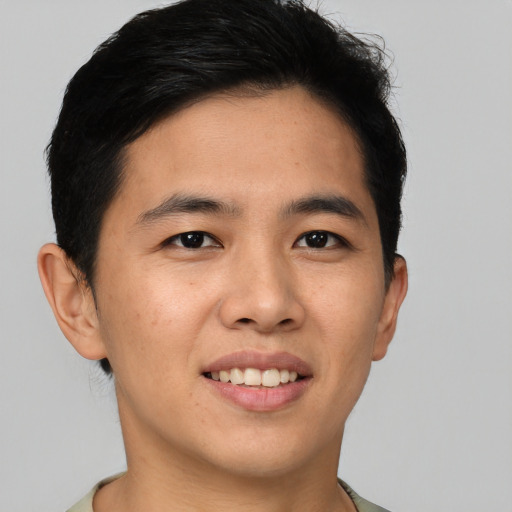 Joyful asian young-adult male with short  brown hair and brown eyes