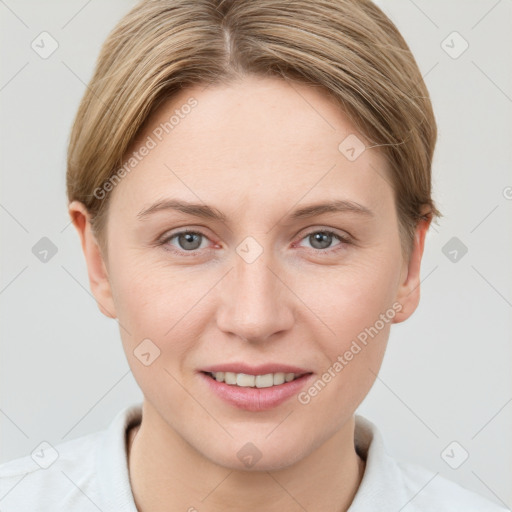 Joyful white young-adult female with short  brown hair and grey eyes