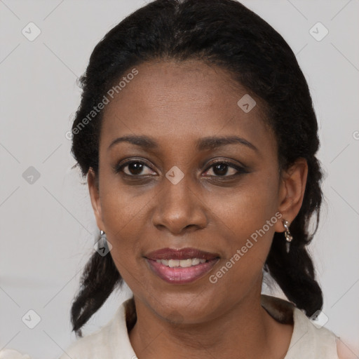 Joyful black adult female with medium  black hair and brown eyes