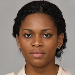 Neutral black young-adult female with short  black hair and brown eyes