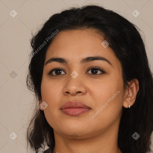 Joyful latino young-adult female with medium  brown hair and brown eyes