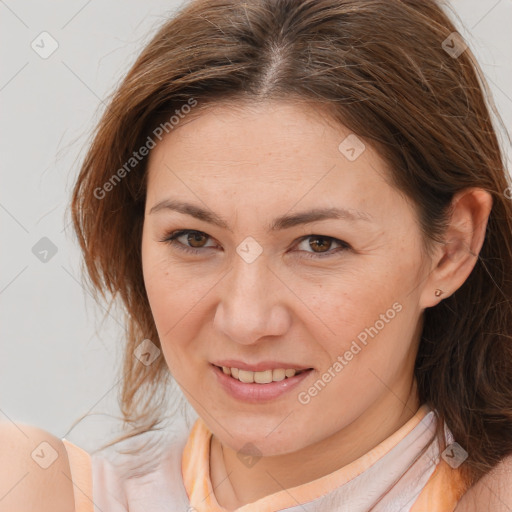 Joyful white adult female with medium  brown hair and brown eyes