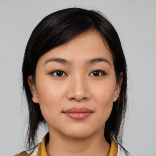 Joyful latino young-adult female with medium  black hair and brown eyes