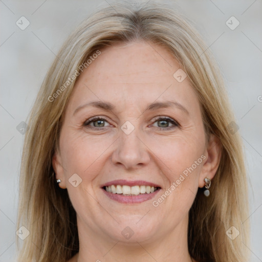 Joyful white adult female with medium  brown hair and grey eyes