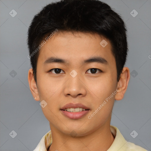 Joyful asian young-adult male with short  black hair and brown eyes