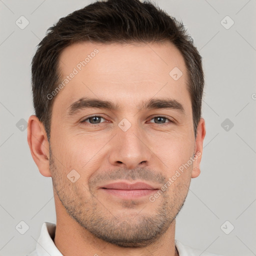 Joyful white young-adult male with short  brown hair and brown eyes