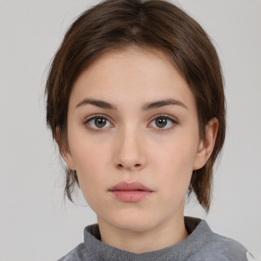 Neutral white young-adult female with medium  brown hair and brown eyes