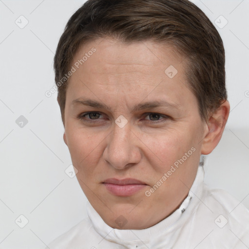 Joyful white adult female with short  brown hair and grey eyes