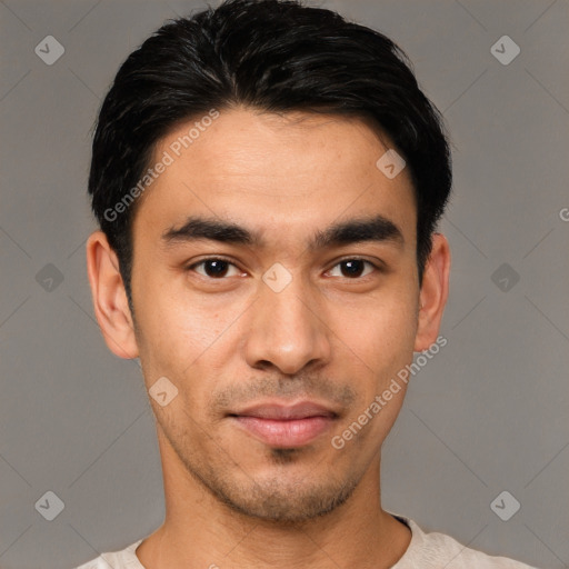 Joyful asian young-adult male with short  black hair and brown eyes