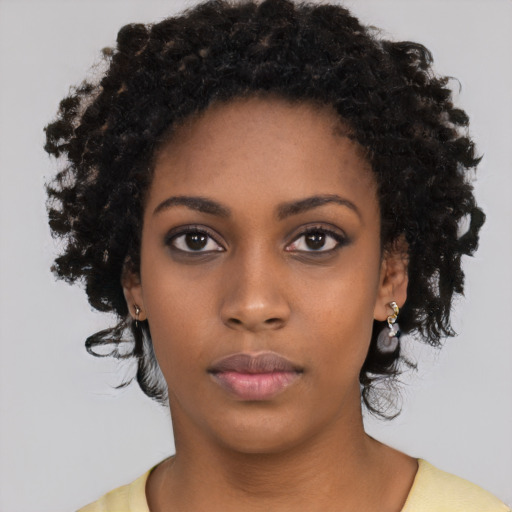 Neutral black young-adult female with medium  black hair and brown eyes
