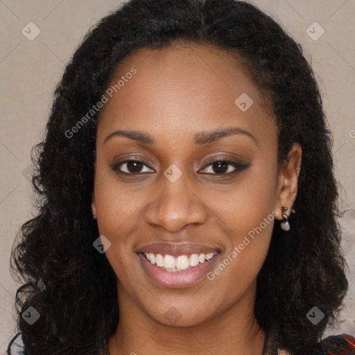 Joyful black young-adult female with long  black hair and brown eyes