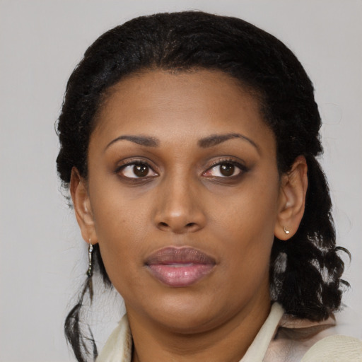 Neutral black young-adult female with medium  brown hair and brown eyes