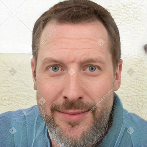 Joyful white adult male with short  brown hair and grey eyes