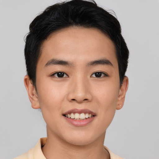 Joyful asian young-adult male with short  black hair and brown eyes