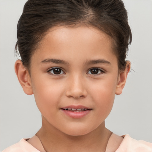 Joyful white child female with short  brown hair and brown eyes