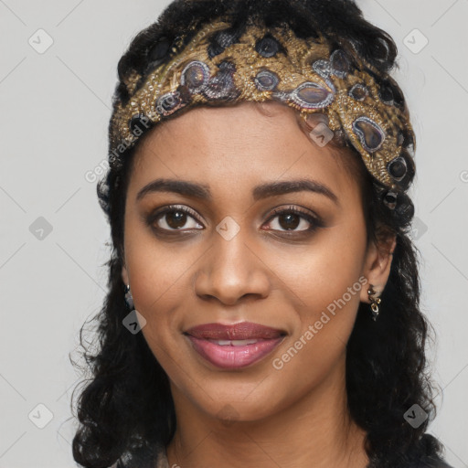Joyful black young-adult female with long  black hair and brown eyes
