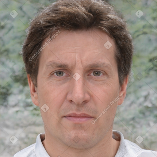 Joyful white adult male with short  brown hair and grey eyes