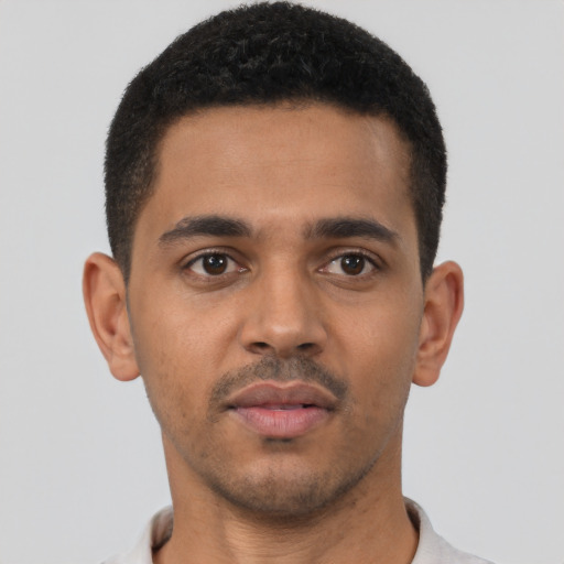 Neutral latino young-adult male with short  brown hair and brown eyes
