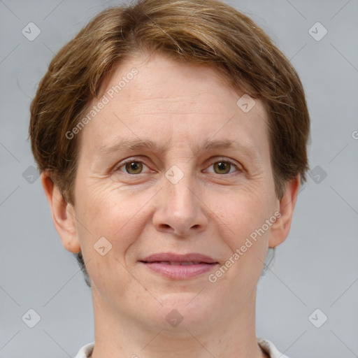 Joyful white adult female with short  brown hair and grey eyes