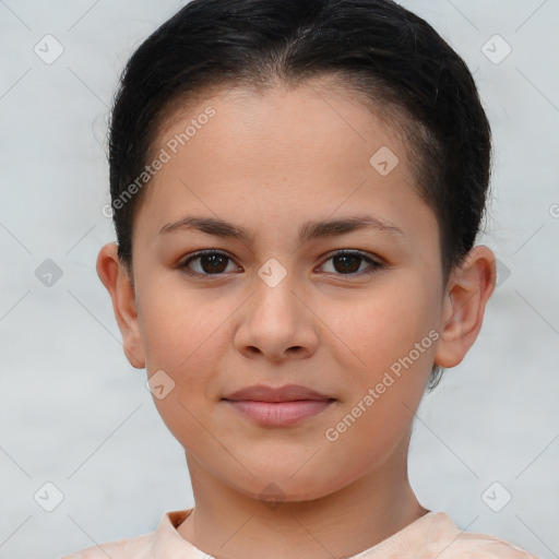 Joyful white child female with short  brown hair and brown eyes