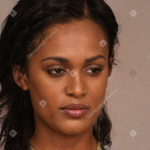 Neutral black young-adult female with long  brown hair and brown eyes