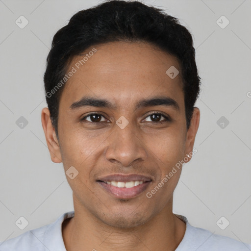 Joyful latino young-adult male with short  black hair and brown eyes