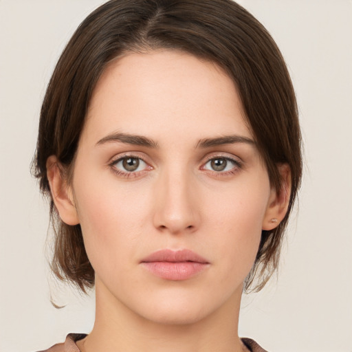 Neutral white young-adult female with medium  brown hair and green eyes