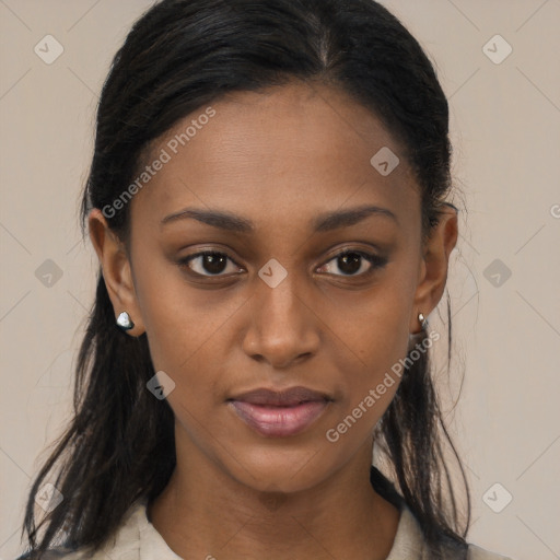 Joyful black young-adult female with long  brown hair and brown eyes