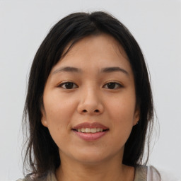 Joyful asian young-adult female with medium  brown hair and brown eyes