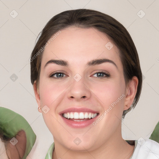 Joyful white young-adult female with medium  brown hair and green eyes