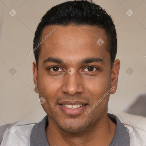 Joyful black young-adult male with short  black hair and brown eyes