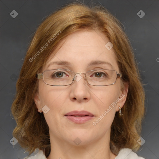 Joyful white adult female with medium  brown hair and blue eyes